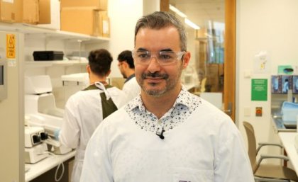 A man in a lab coat and glasses